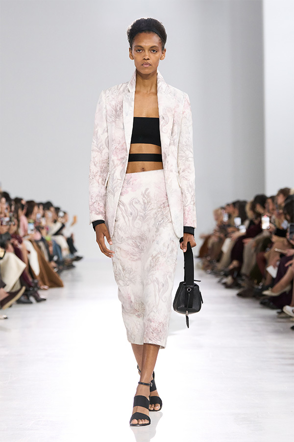 Max Mara Spring/Summer 2026 Fashion Show - White Look with Blazer and Close-fitting Skirt with small black bag.