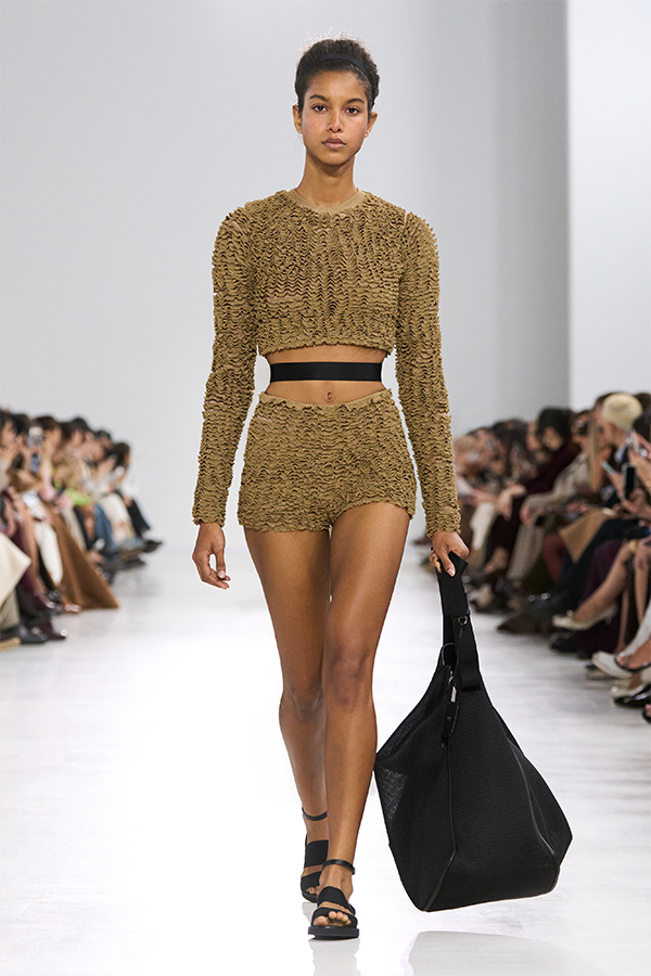 Max Mara Spring/Summer 2026 Fashion Show - Look with Cropped Jumper and plain Shorts and black bag.