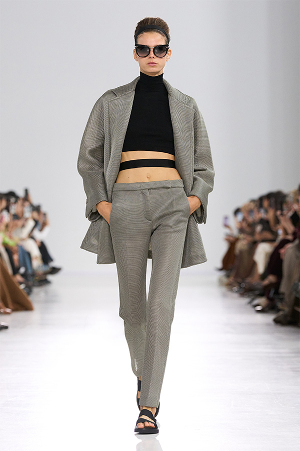 Max Mara Spring/Summer 2026 Fashion Show - Look with grey trousers and jacket and black turtleneck.